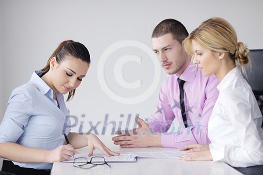 business people team at a meeting in a light and modern office environment. business people team at a meeting in a light and modern office environment.