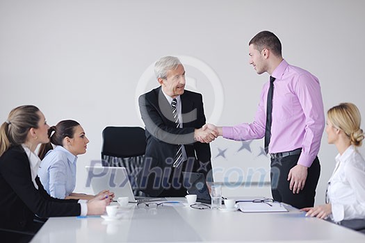 business people team at a meeting in a light and modern office environment. business people team at a meeting in a light and modern office environment.