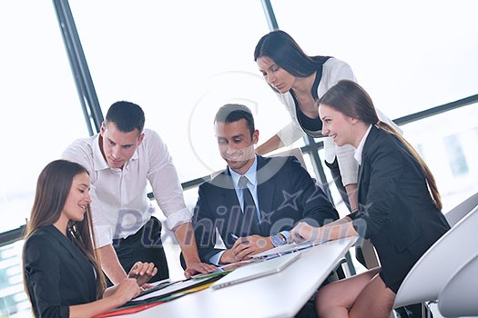 Group of happy young business people in a meeting at office Group of happy young business people in a meeting at office