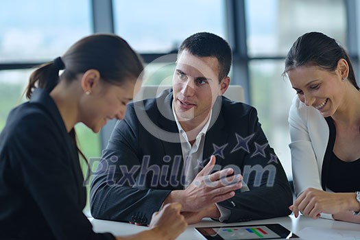Group of happy young business people in a meeting at office Group of happy young business people in a meeting at office