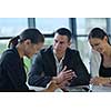 Group of happy young  business people in a meeting at office