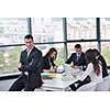business people group joining hands and stay as team in circle  and representing concept of friendship and teamwork