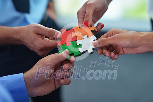Group of business people assembling jigsaw puzzle and represent team support and help concept Group of business people assembling jigsaw puzzle and represent team support and help concept