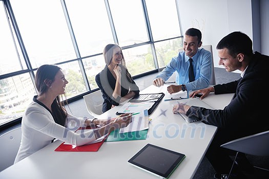 Group of happy young business people in a meeting at office Group of happy young business people in a meeting at office
