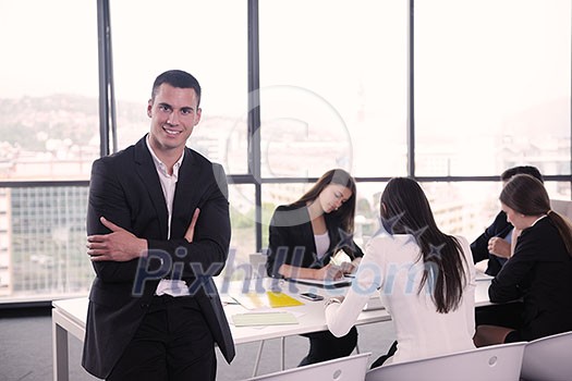 Group of happy young business people in a meeting at office Group of happy young business people in a meeting at office