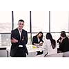 Group of happy young  business people in a meeting at office