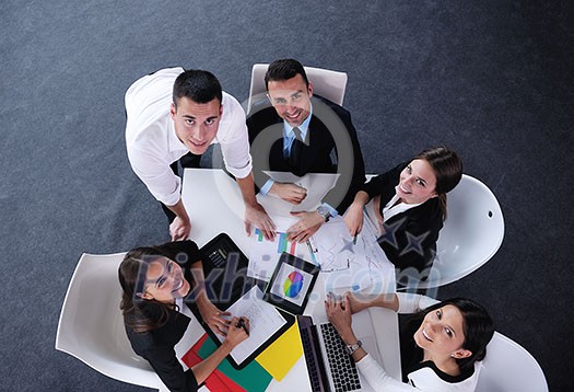 Group of happy young business people in a meeting at office Group of happy young business people in a meeting at office