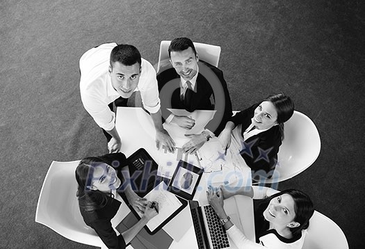 Group of happy young business people in a meeting at office Group of happy young business people in a meeting at office