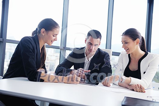 Group of happy young business people in a meeting at office Group of happy young business people in a meeting at office