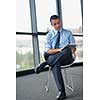 happy young business  man work in modern office on computer