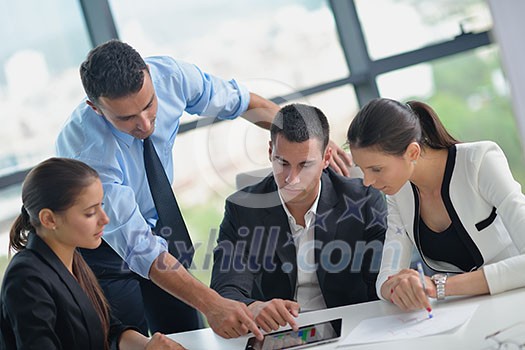 Group of happy young business people in a meeting at office Group of happy young business people in a meeting at office
