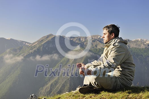 healthy young man practice youga in height mountain at early morning and sunrise