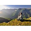 healthy young man practice youga in height mountain at early morning and sunrise