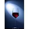 red wine in glass on blue