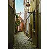 Old street with flowers in Brussels, Belgium