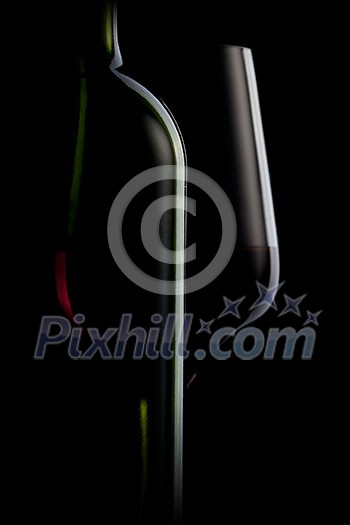red wine in glass and bottle isolated on black red wine in glass and bottle isolated on black
