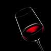 red wine in glass isolated on black