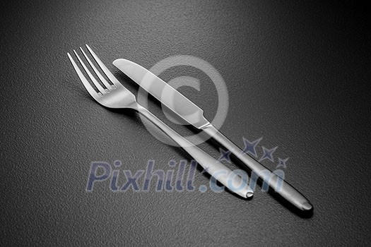 knife and fork on black knife and fork on black
