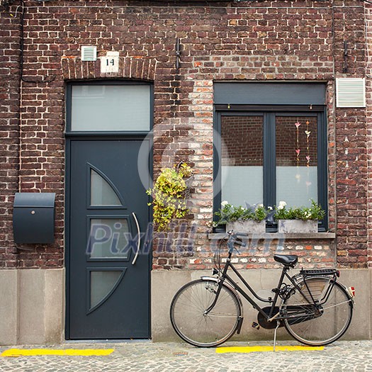 Bicycle on the street in Bruges, Belgium Bicycle on the street in Bruges, Belgium