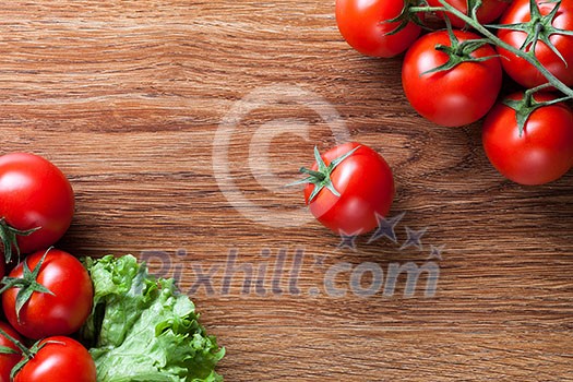 red tomatoes with green salad on wood red tomatoes with green salad on wood
