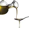 Pouring oil from jar on spoon isolated on white