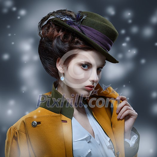 Portrait of elegant girl in a hat with a feather. Portrait of elegant girl in a hat with a feather.