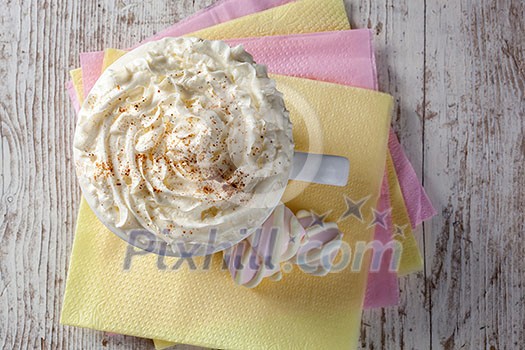 hot chocolate with marshmallows and cream on wooden background hot chocolate with marshmallows and cream on wooden background