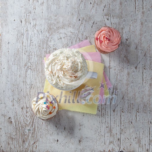 hot chocolate with marshmallows and cream on wooden background hot chocolate with marshmallows and cream on wooden background