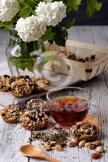 Cup of tea and cookies made of nuts and raisins. Kozinaki. Cup of tea and cookies made of nuts and raisins. Kozinaki.