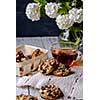 Cup of tea and cookies made of nuts and raisins. Kozinaki.