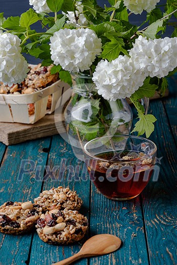 Cup of tea and cookies made of nuts and raisins. Kozinaki. Cup of tea and cookies made of nuts and raisins. Kozinaki.
