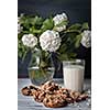 Glass of milk and cookies made of nuts and raisins. Kozinaki.