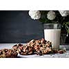 Glass of milk and cookies made of nuts and raisins. Kozinaki.