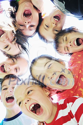 happy child group smilling together and hold heads very close happy child group smilling together and hold heads very close