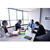 Group of happy young  business people in a meeting at office