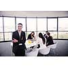Group of happy young  business people in a meeting at office