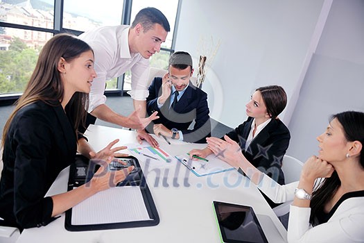 Group of happy young business people in a meeting at office Group of happy young business people in a meeting at office