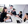 Group of happy young  business people in a meeting at office