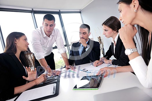 Group of happy young business people in a meeting at office Group of happy young business people in a meeting at office