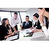Group of happy young  business people in a meeting at office