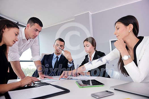 Group of happy young business people in a meeting at office Group of happy young business people in a meeting at office