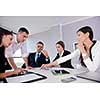 Group of happy young  business people in a meeting at office