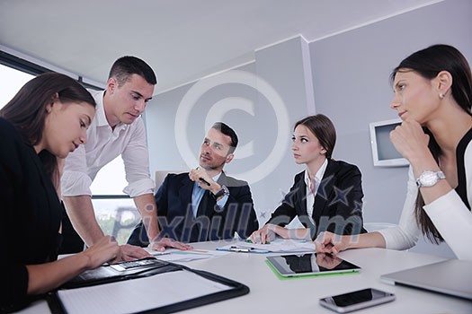 Group of happy young business people in a meeting at office Group of happy young business people in a meeting at office
