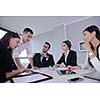 Group of happy young  business people in a meeting at office