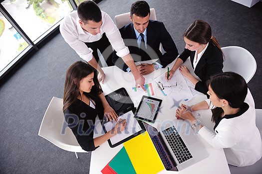 Group of happy young business people in a meeting at office Group of happy young business people in a meeting at office