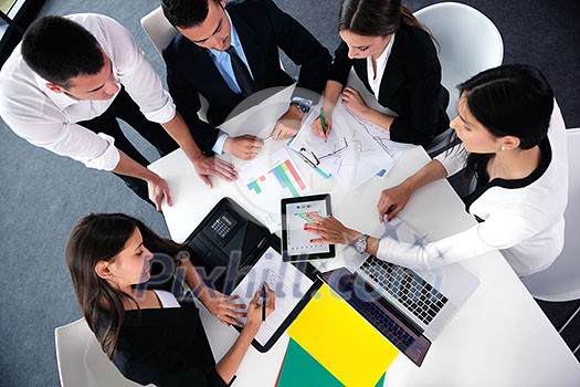 Group of happy young business people in a meeting at office Group of happy young business people in a meeting at office