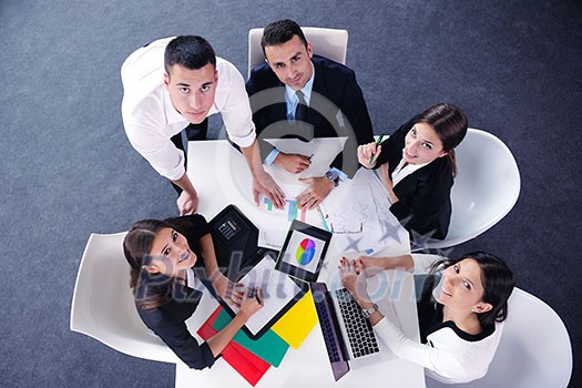 Group of happy young business people in a meeting at office Group of happy young business people in a meeting at office
