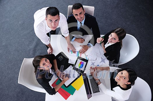 Group of happy young business people in a meeting at office Group of happy young business people in a meeting at office