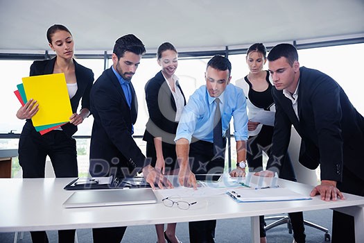 Group of happy young business people in a meeting at office Group of happy young business people in a meeting at office