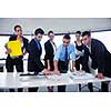 Group of happy young  business people in a meeting at office